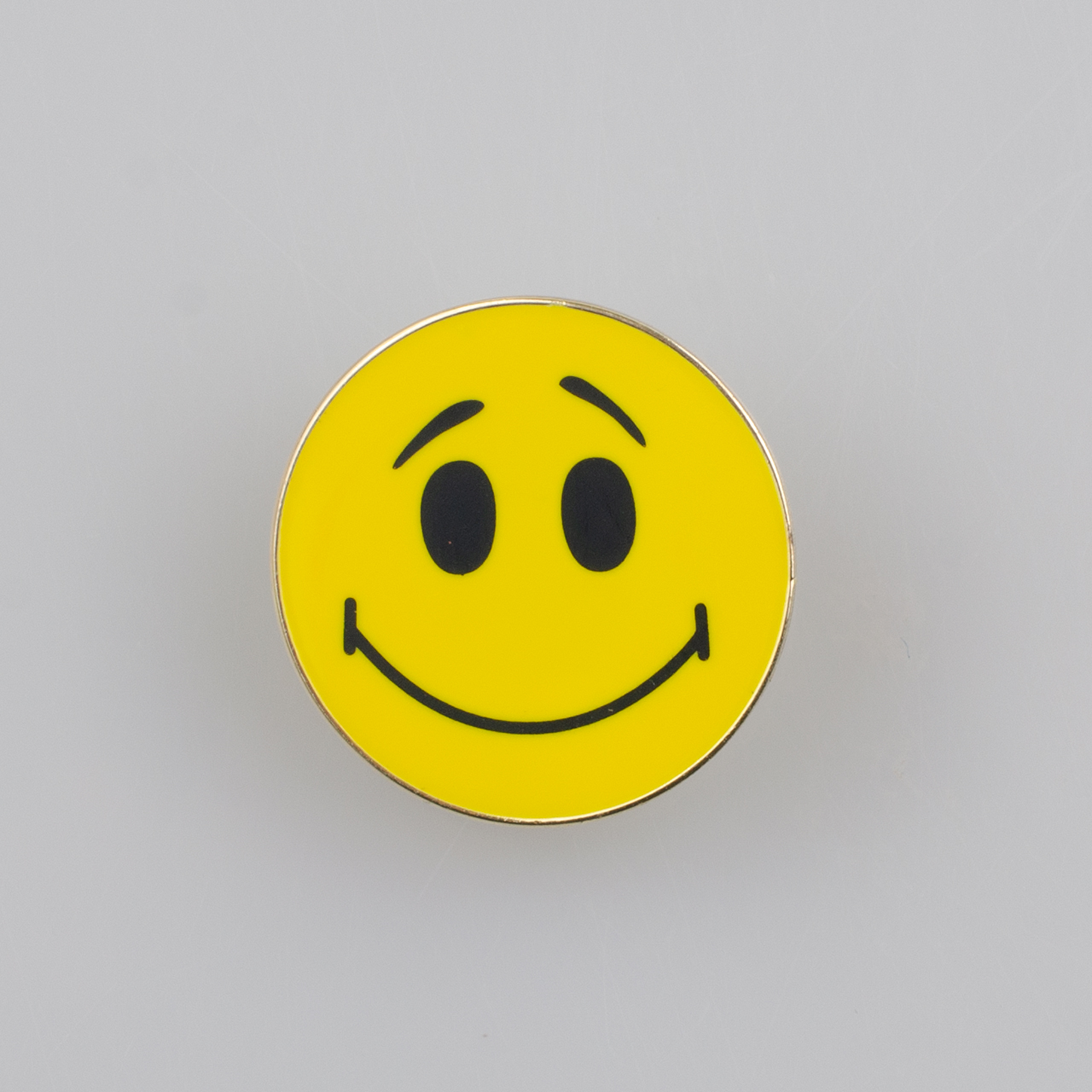 Uśmiechnięta buźka Smile, okrągły metalowy znaczek pin, śr. 22 mm