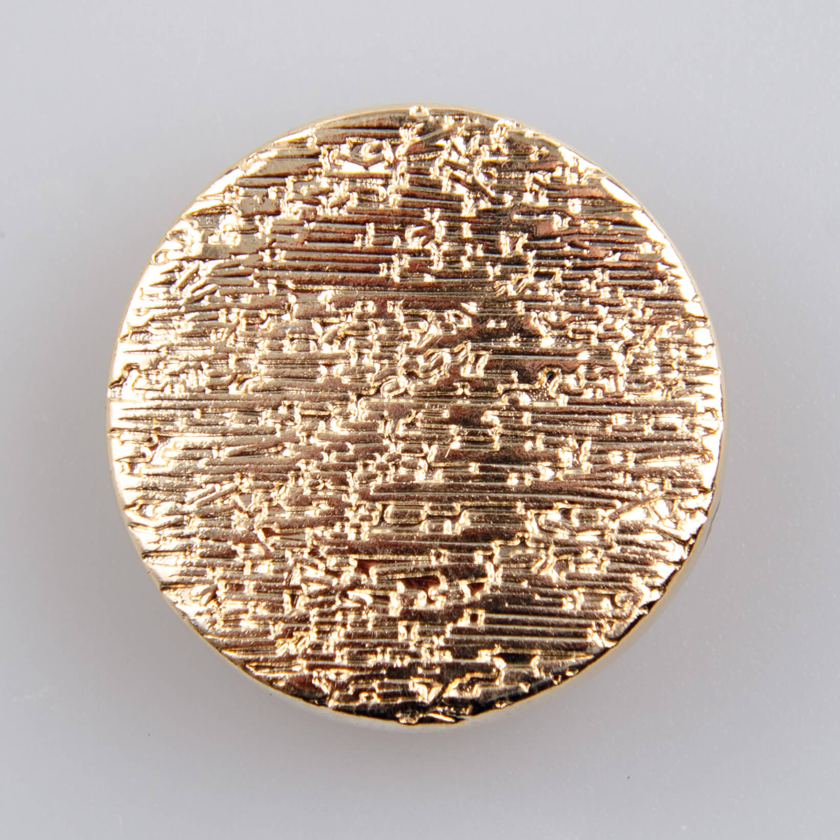 Guzik płaski metalowy gładki złoty, wzór kamień, śr. 25 mm